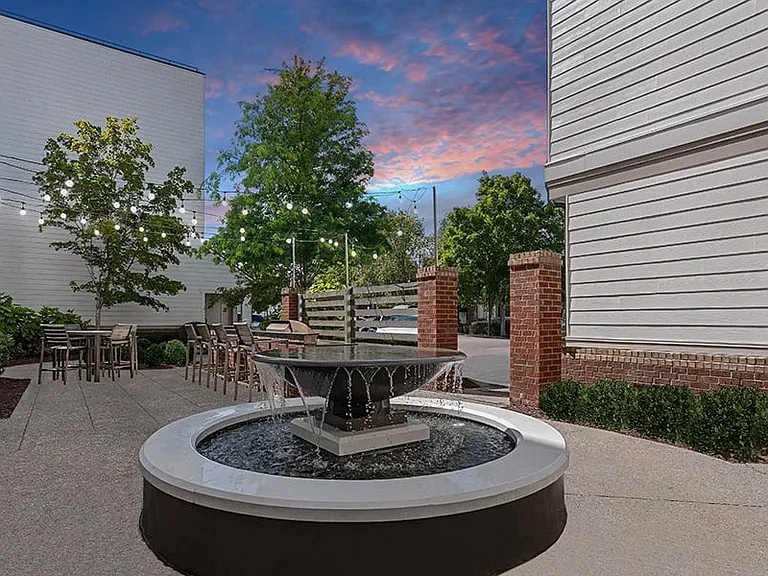 Spacious courtyard with fire pits, grilling station and dining area