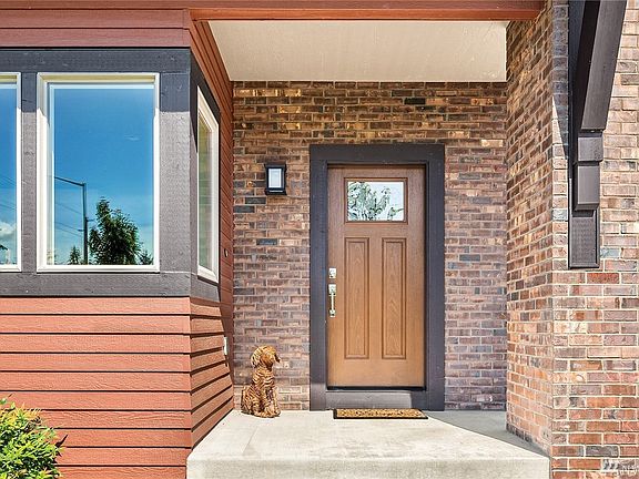 Inviting entry with masonry surround.