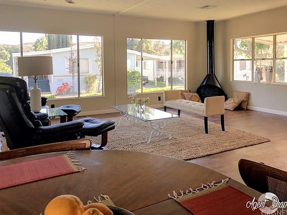 Living room has large windows for cool breezes and