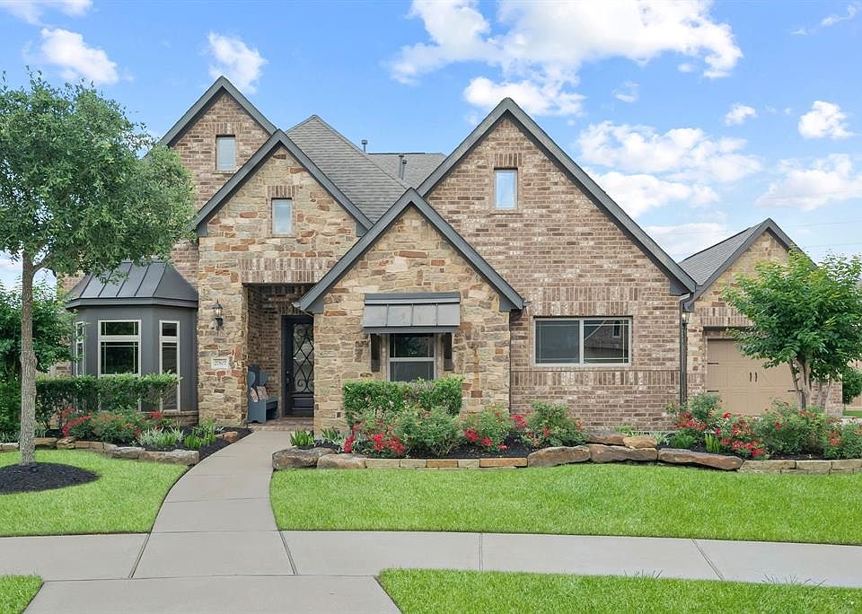 Welcome to 27807 Cenizo Park Ct.! Beautiful curb appeal with hard wired landscape lighting, stone lined beds and situated on a culdesac lot!