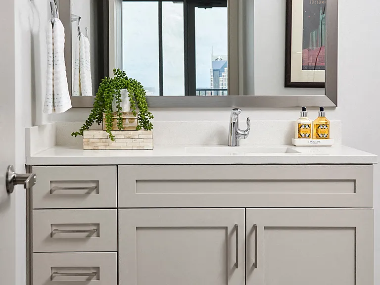 Baths with framed mirrors and ample cabinet space
