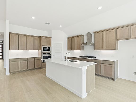 Kitchen in the Gilmour II home plan by Trophy Signature Homes - REPRESENTATIVE PHOTO