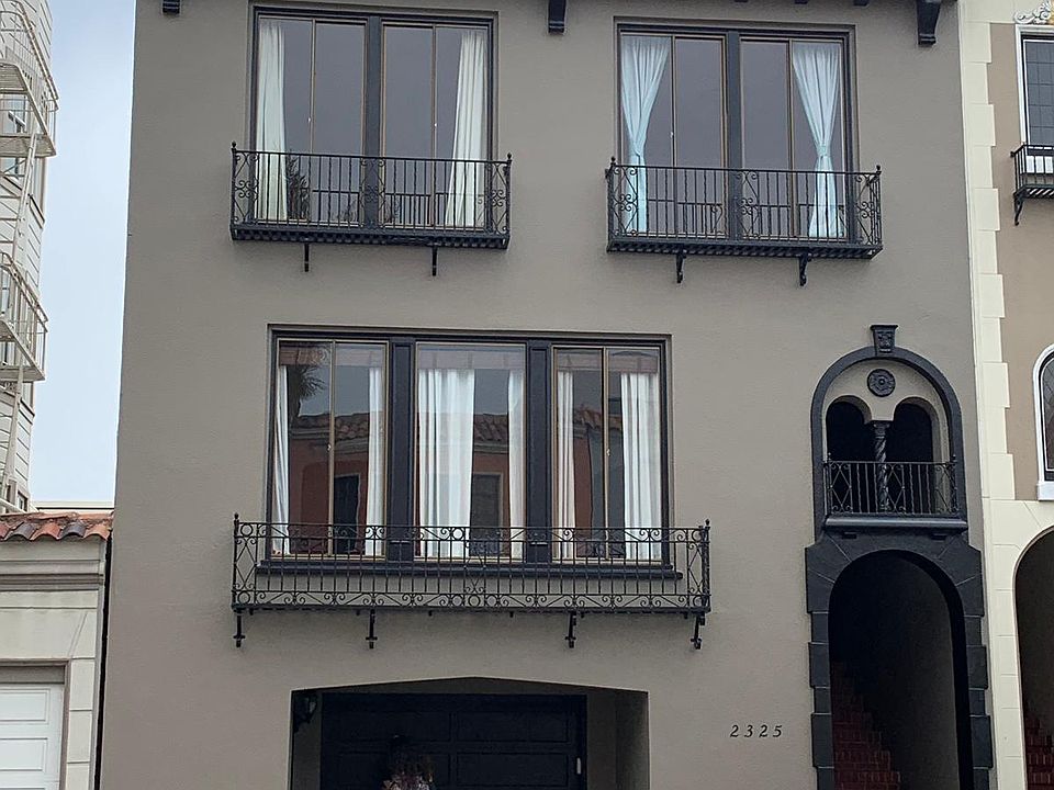 Front of building. Flat is the full floor above the garage.