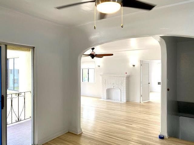 Private upstairs entry into dining area with balcony, open to living room. Double doors from living room to den.