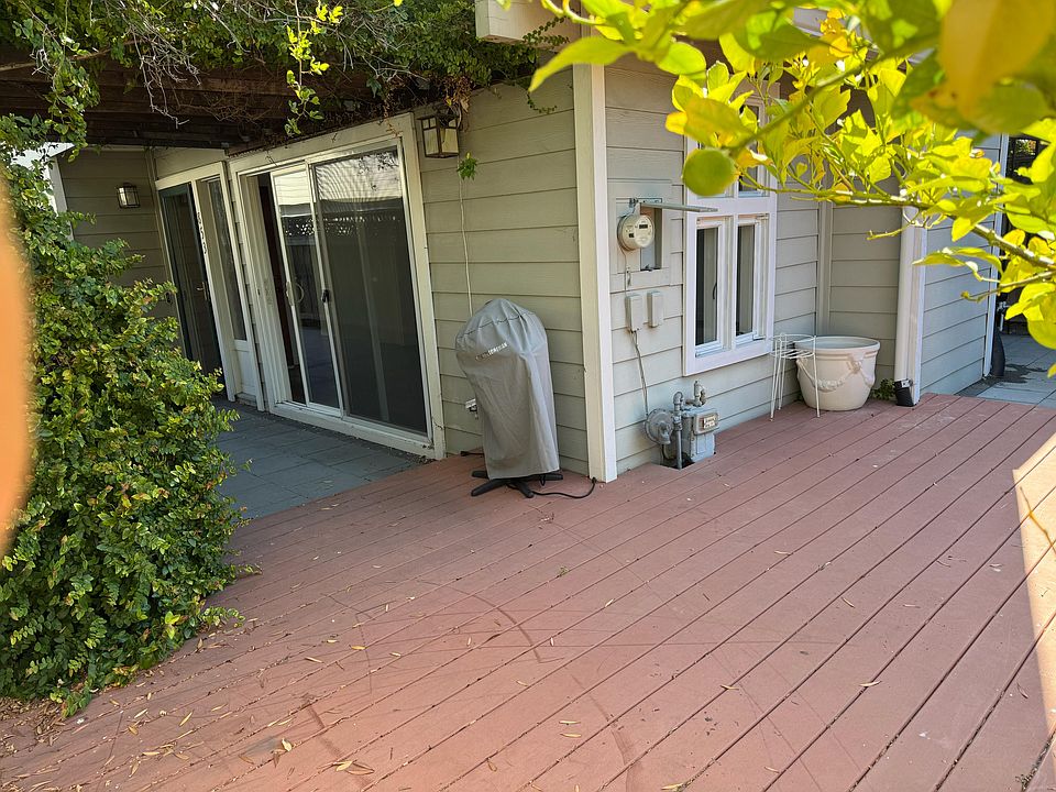 L shaped patio with a deck