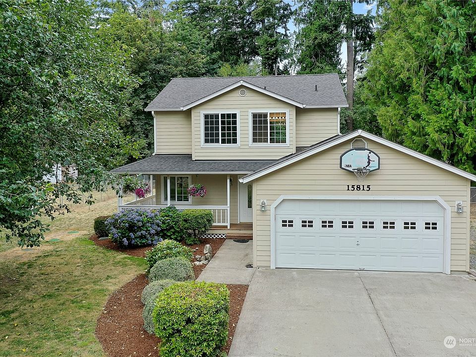 Drone view of front of home. I love the curb appeal and the large driveway for your friends and you.>