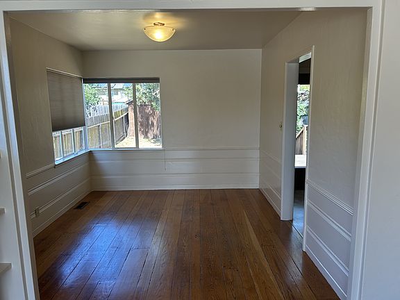 Dining room off living room and leading to kitchen