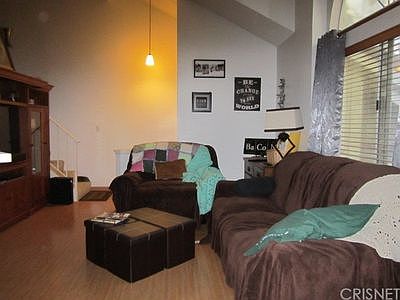 Living room. Stairs to loft 