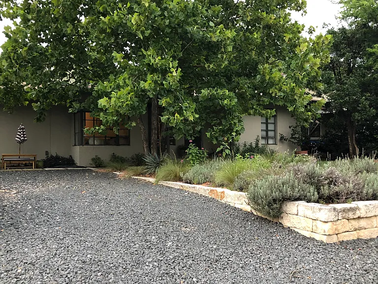 Walk up driveway to get to side gate for path to back house