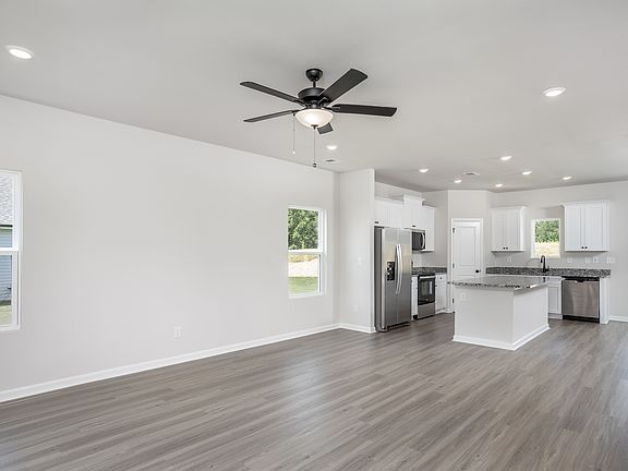 Living room has vinyl plank flooring