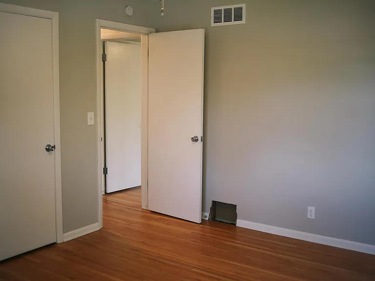 2nd bedroom located in upstairs of this split level home. Easily fits a queen size bed and nice size closet for storage. Two updated windows let in gorgeous natural light.