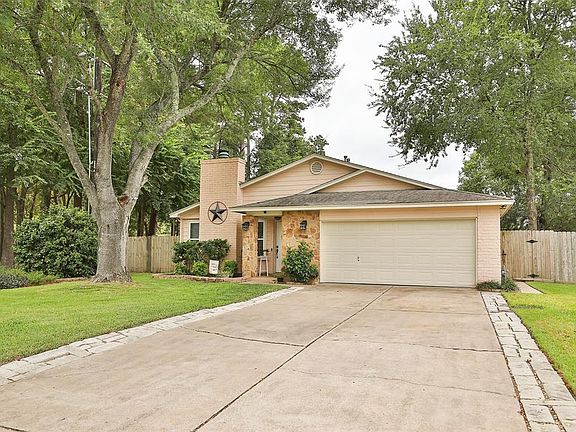Double wide driveway has been extended with brick pavers.