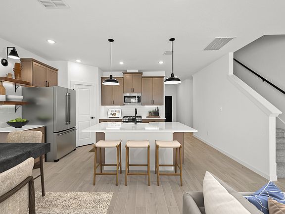 Kitchen with pendant lighting floating shelves