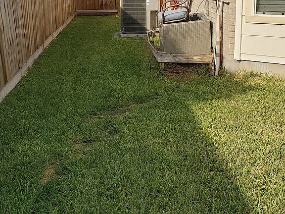 Backyard with new fence and new gate