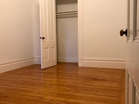 Large bedroom with closet, dual entry to bath and original trim