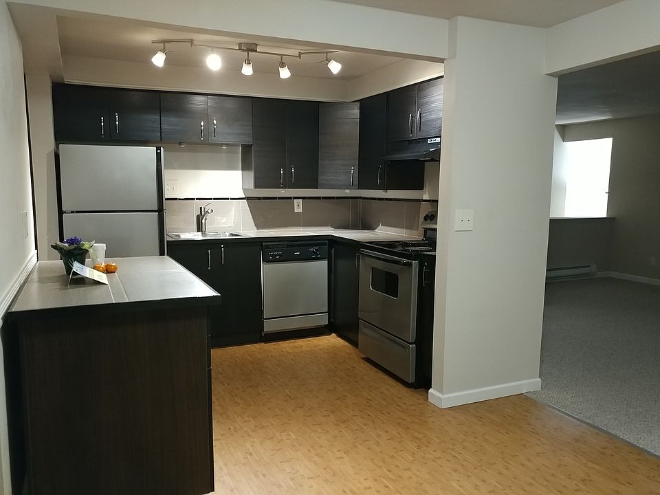 Kitchen with bamboo flooring.
Movable island