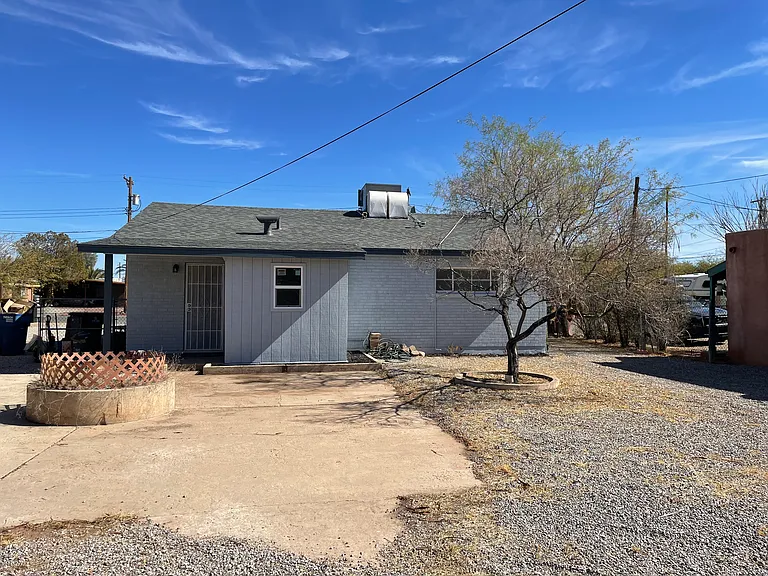 Backyard with privacy, fire pit. and hook up for washer/ gas dryer .