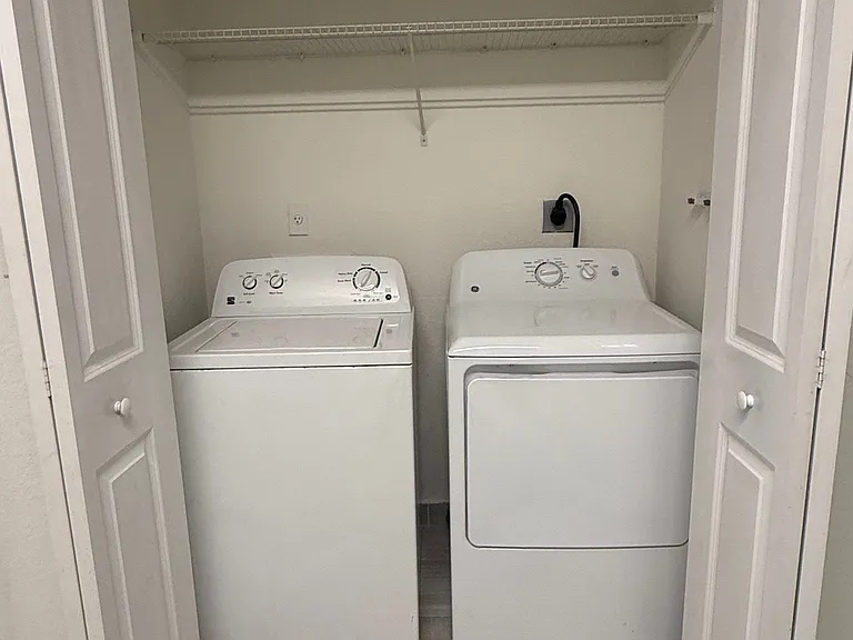 Full size washer and dryer included and with extra shelving for storage