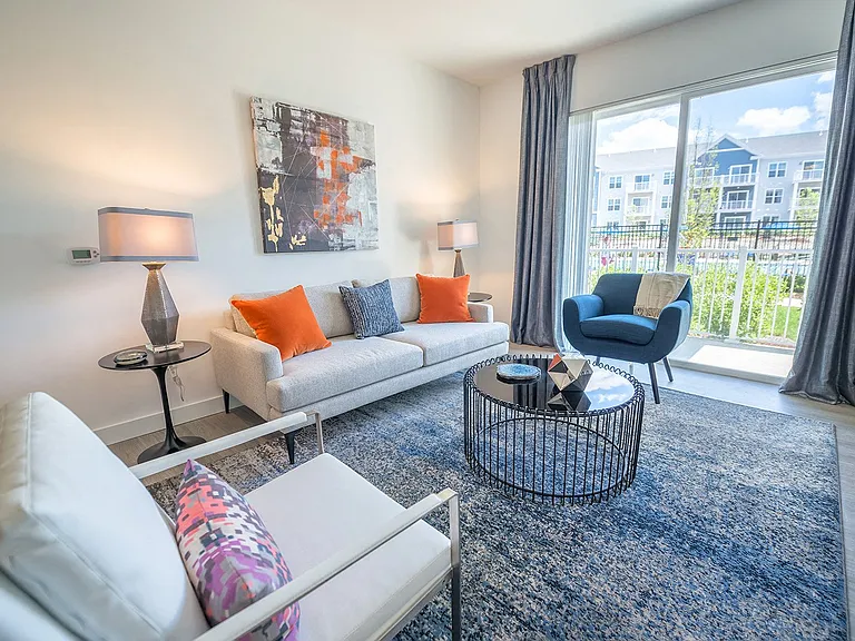 Living room opens up onto balconies, in select apartment homes
