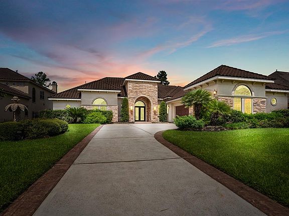 Welcome to 39 Manor Lake Estates Drive, a stunning 1.5 story Mediterranean lakefront property in gated Manor Lake of premier master planned community of Gleannloch Farms.