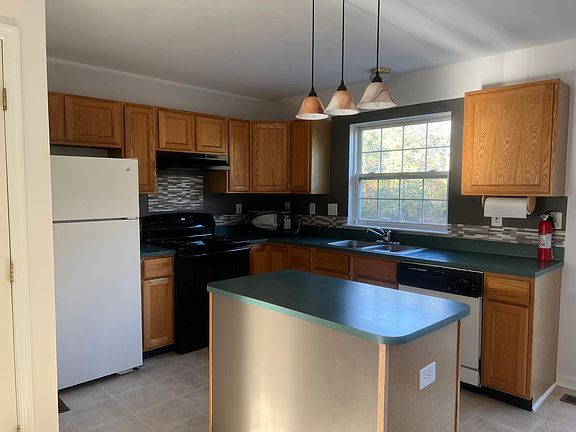Kitchen with attached pantry and adjoining powder room