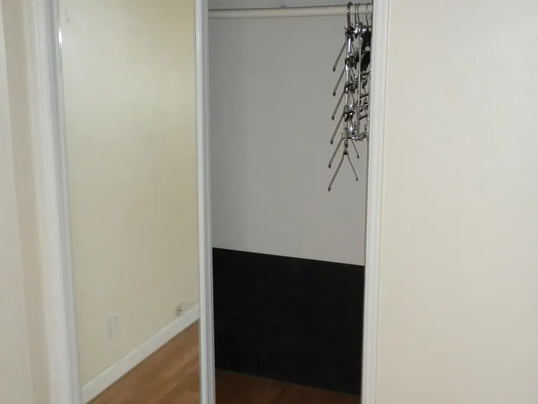 Bedroom closet Small closet with mirror but ample cabinets in the bedroom