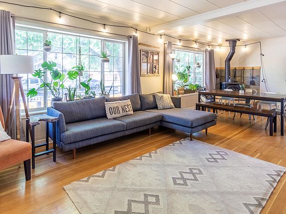 Living Room (couch, chair, floor lamp, dining table, plants, curtains, rug, decor included)