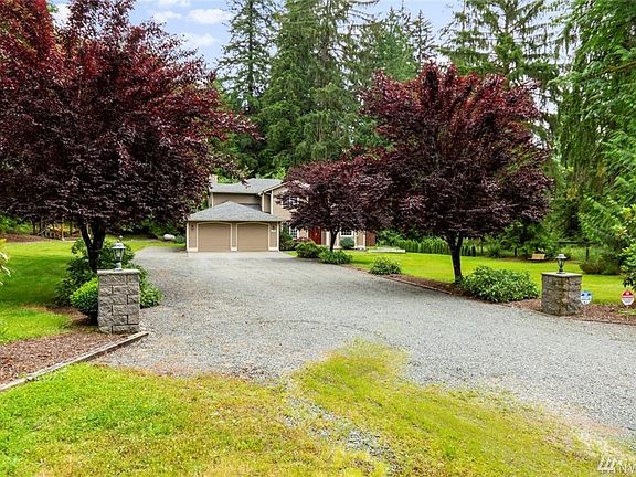 Pull into your private tree lined driveway with ample parking.