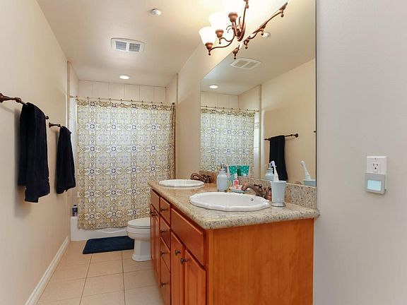 2nd full bathroom upstairs. Tub with shower and 2 sinks