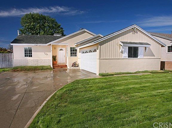 This beautifully remodeled home is located on a tree-lined street in one of Granada Hills nicest neighborhoods and is nestled on a large 7,500 sq. ft. lot.  Its gated entryway, lush lawn, covered porch and freshly painted exterior enhance its eye catching