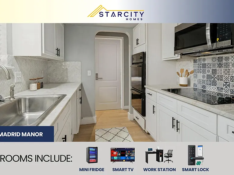 Galley kitchen with white cabinetry, ample counter space, stainless sink, and built-in microwave/oven for easy meals.