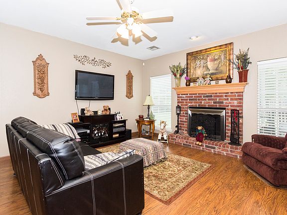 Cozy full brick fireplace in living