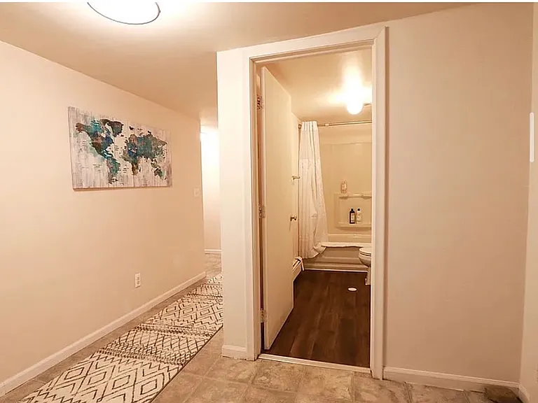 Finished basement with flexible additional living space (2 rooms, full bath).