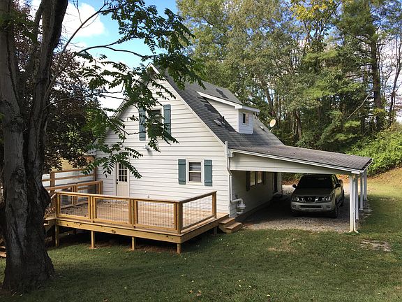 New deck, covered carport.