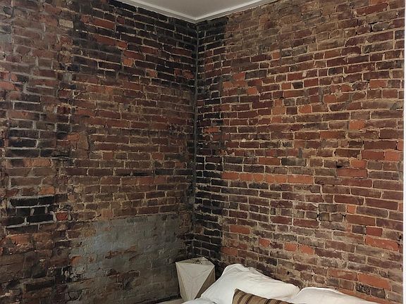 Exposed bedroom walls.