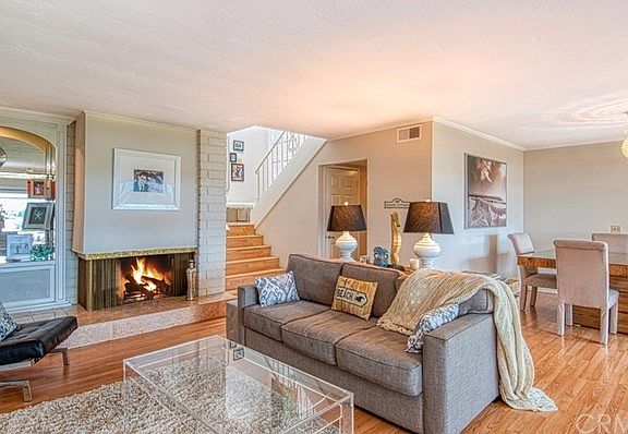 Living Room with Fireplace and Dining Room