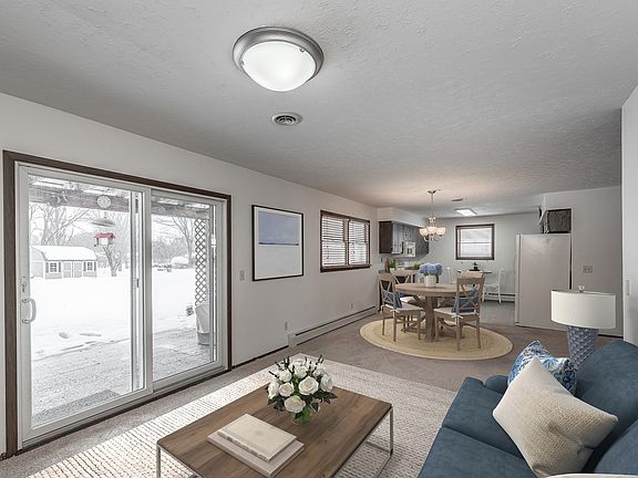 This area is the heart of the home! Bright and sunny with direct access to the large yard and all th