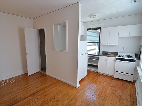Another view of the main living space. The open door you see on the left is the bathroom again, and to the right is the kitchen. Behind you is the Bedroom.