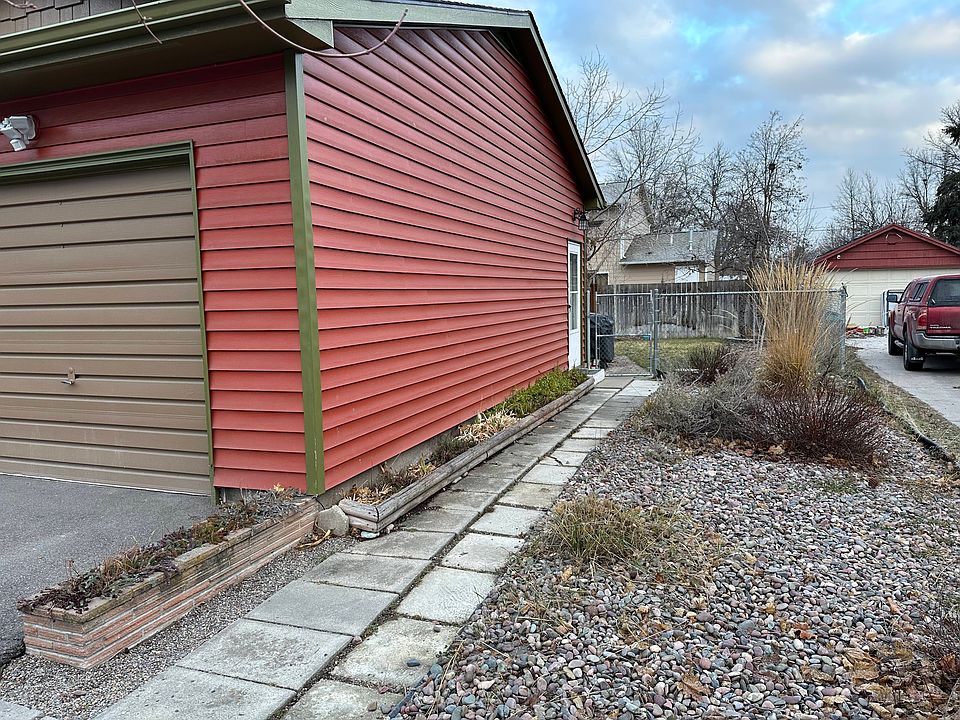 Side entrance uses a shared mudroom with locked entry at the bottom of the stairs.