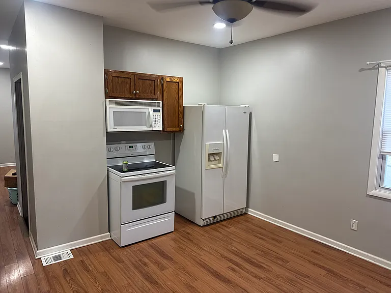 Fully equipped kitchen with appliances, dishwasher, and washer/ dryer hook ups - everything you need all in one place.