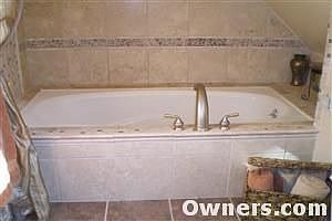 Jacuzzi Bath with Marble Tub Surround
