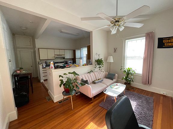 Living Room looking into the kitchen with a wide angle lease.