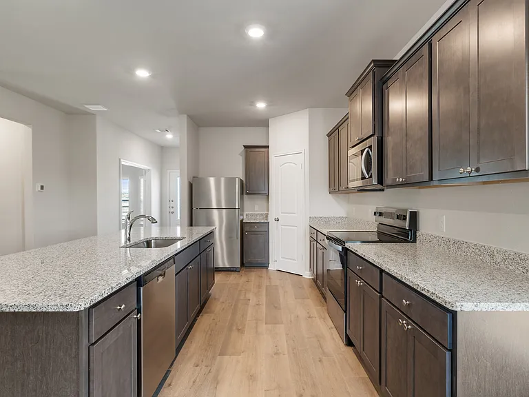 The kitchen has energy-efficient appliances.