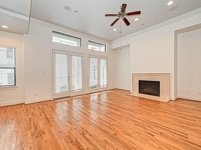 2nd floor living room with fireplace and newly mounted TV (will stay with the house, not in the picture)