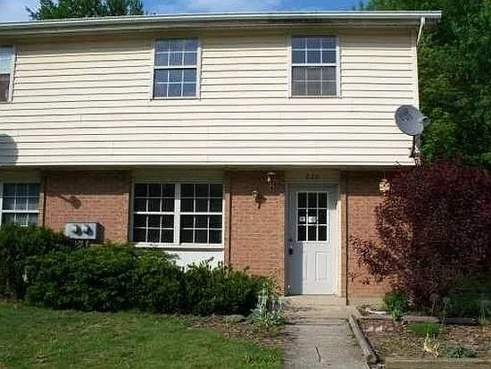 2 story end townhouse with large yard and new deck in back with offstreet parking for a couple cars.