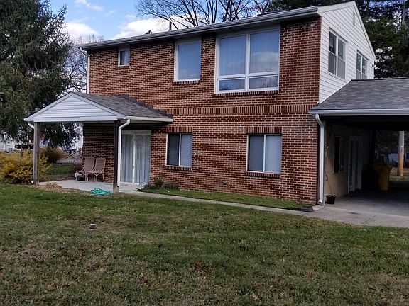 Side view with a portion of carport visible