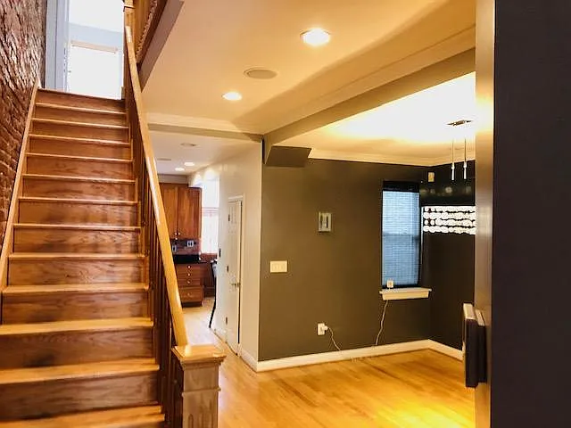 View of main staircase leading to 2nd floor that has 3 BR and 2 BA. New skylight overlooking staircase provides excellent natural lighting