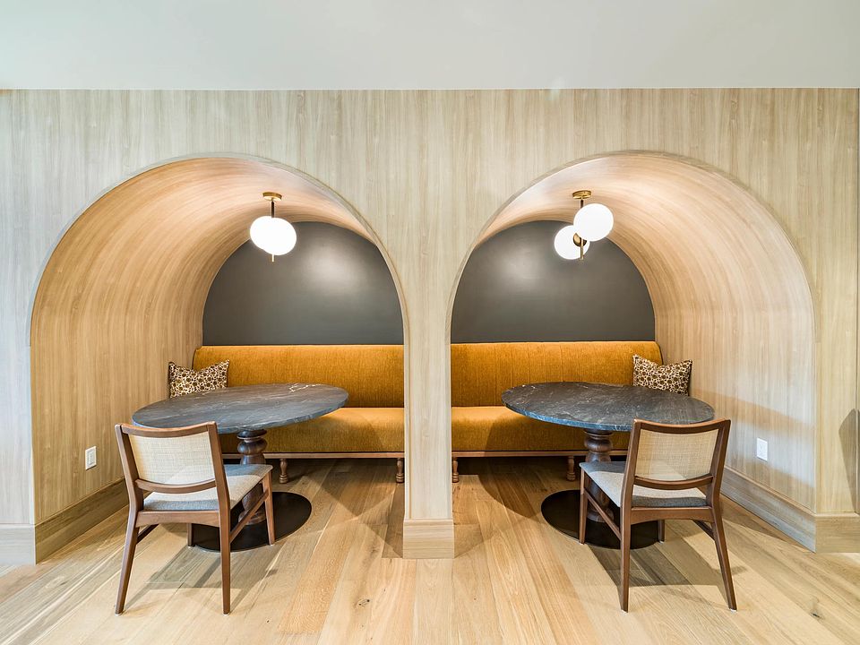 Architectural seating alcoves at Modera University Park, designed for intimate conversations or quiet co-working within the community's refined shared spaces.