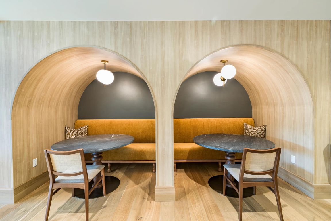 Architectural seating alcoves at Modera University Park, designed for intimate conversations or quiet co-working within the community's refined shared spaces.