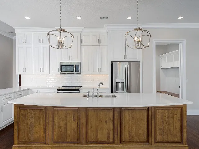 Open kitchen with tons of storage, quartz countertops and stainless steel appliances. Open kitchen with tons of storage, quartz countertops and stainless steel appliances.